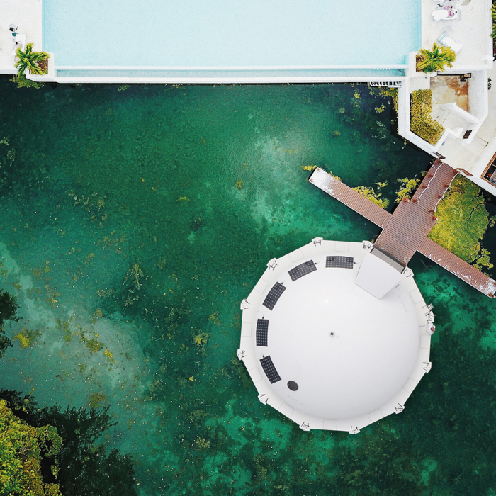 aerial shot of the Anthenea docked at a residential area