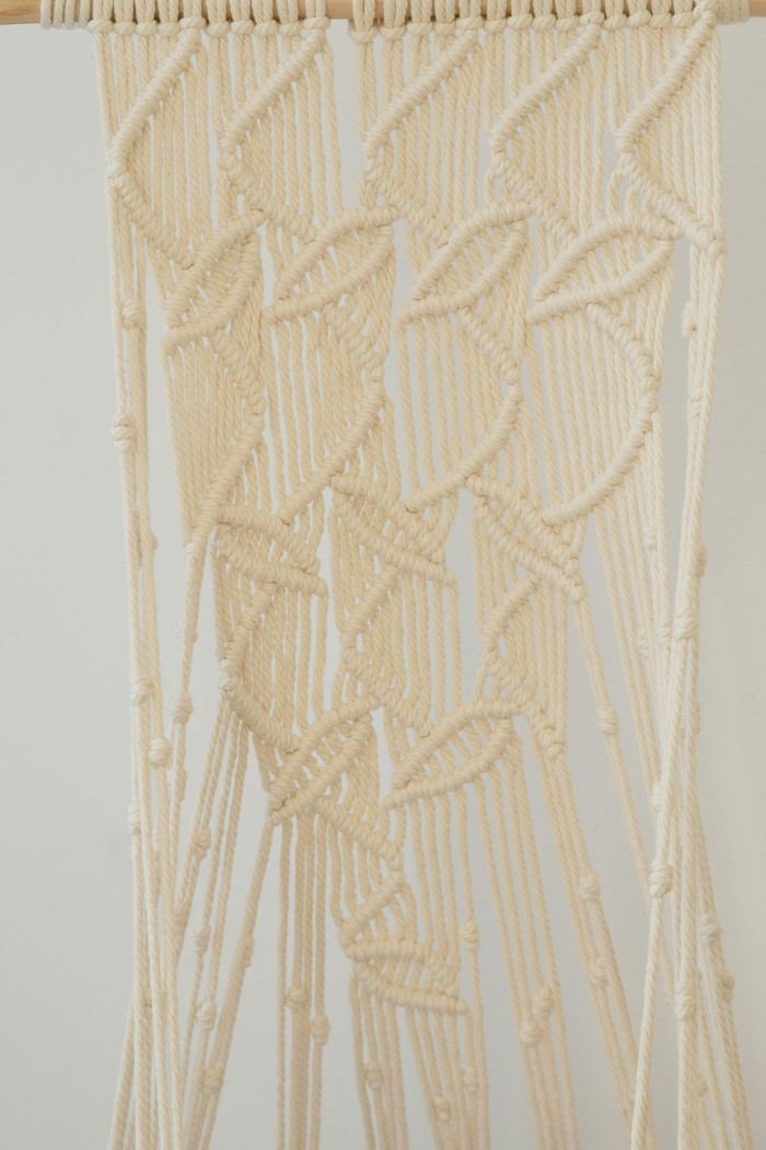 detail shot of the natural white leaf-patterned hanging cat hammock