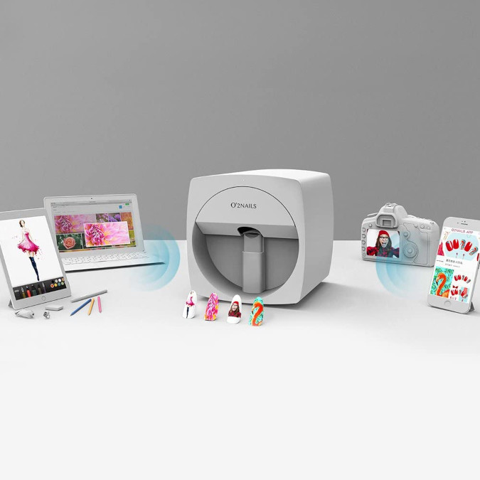 O2Nails Digital Nail Printer in white surrounded by compatible devices it can receive pictures from