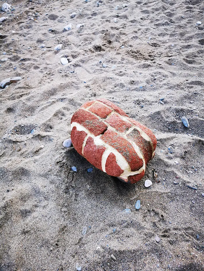 piece of wall rounded by sea