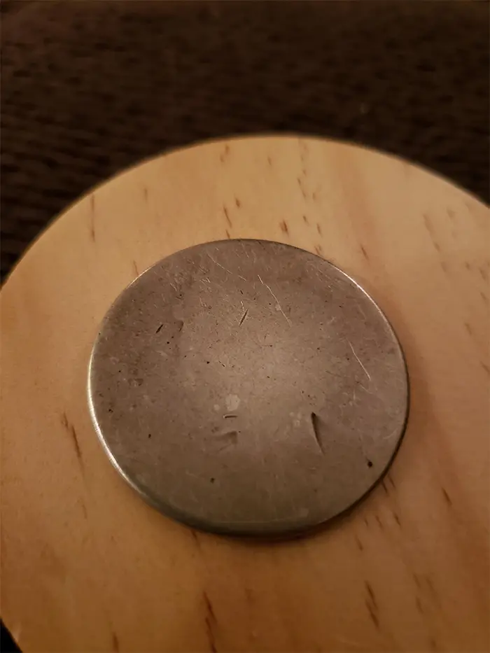 worn out liberty dollar coin