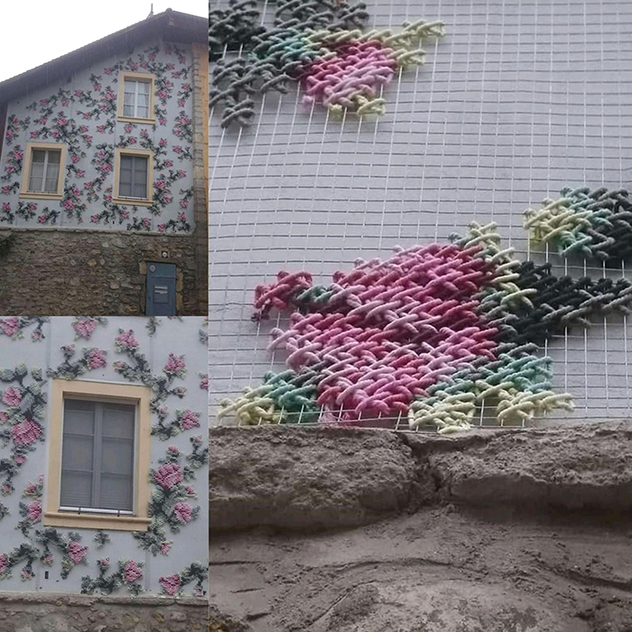 cross-stitch art flowers on house wall