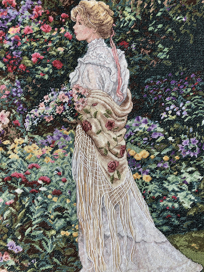 cross-stitch art lady in garden