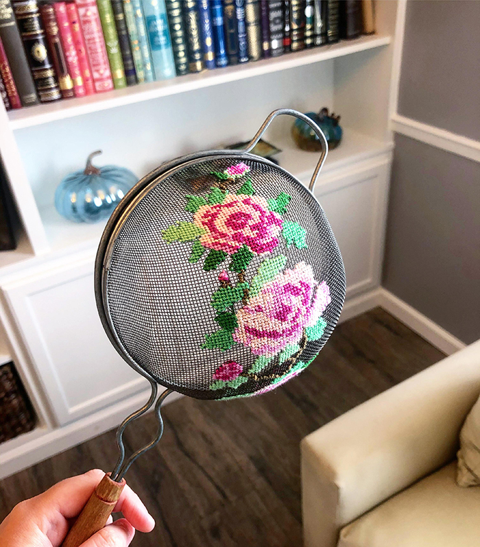 cross-stitch art pink roses on old strainer