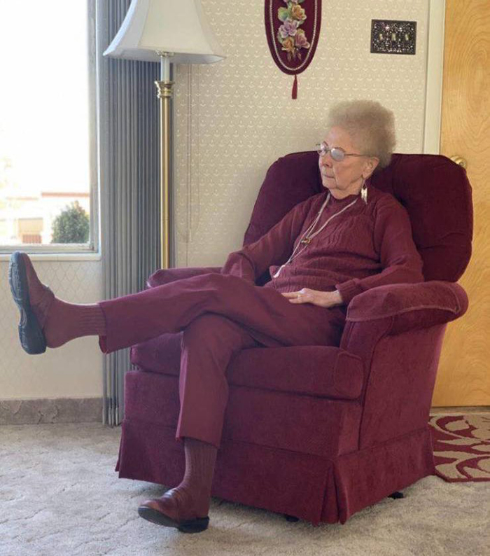 grandmother wearing matching color with her chair