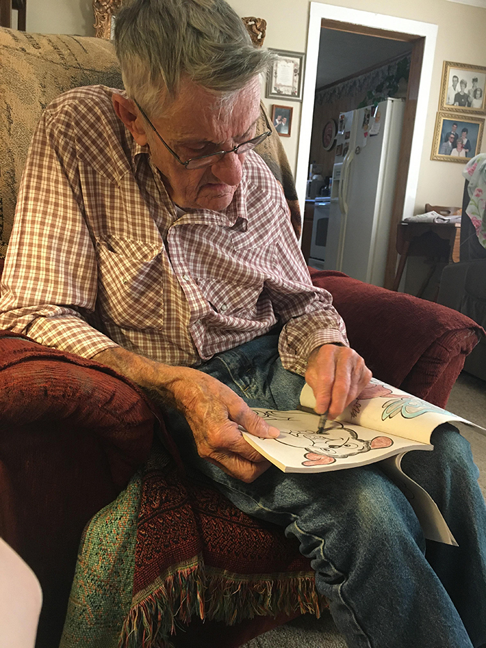 old people being wholesome grandfather working on coloring book page