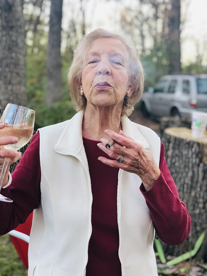 old people being wholesome grandmother smoking cigar and drinking wine