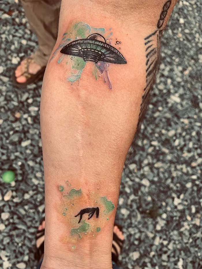 tattoo cover-ups arm scar ufo