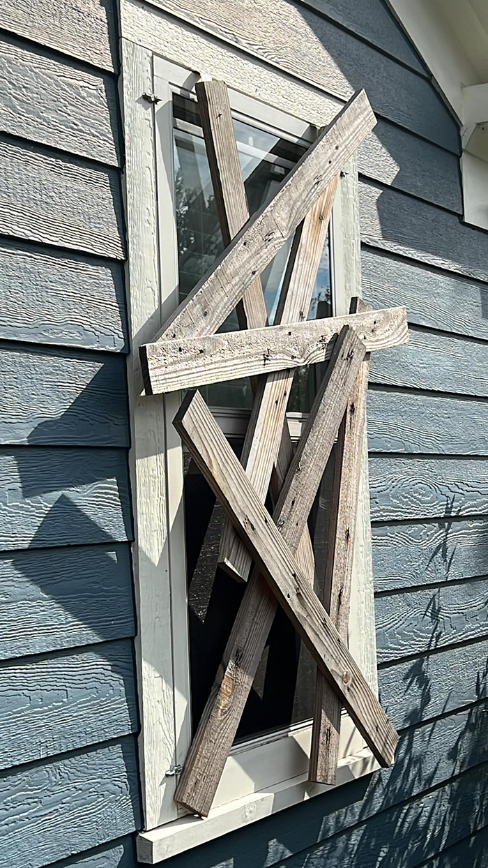 alan perkins diy halloween decoration boarded-up window day view