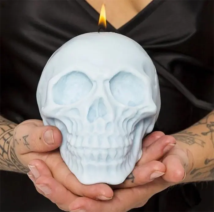 large skull candle pastel blue