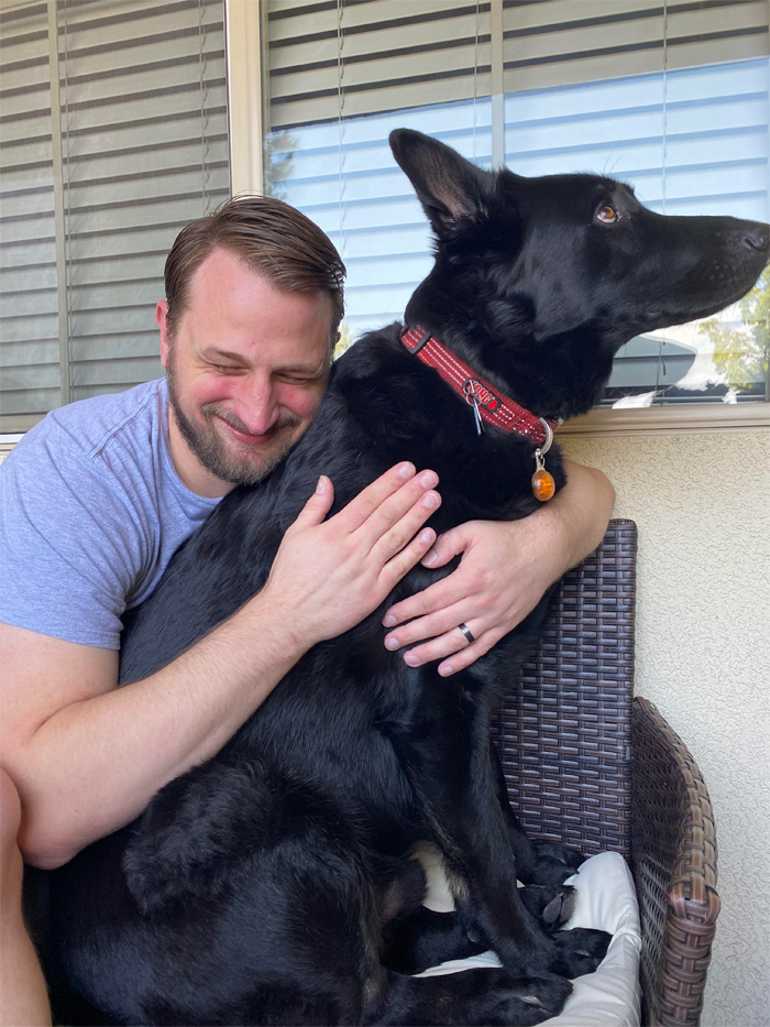 dog lets man hug him after two years