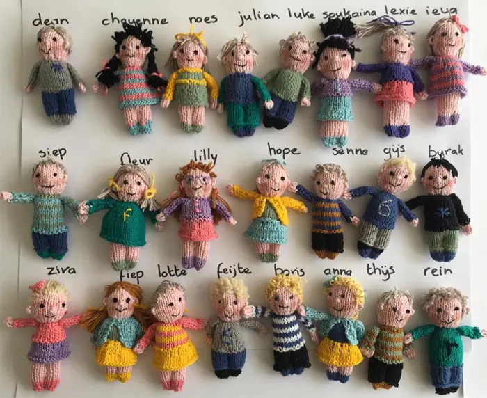 teacher knitted dolls of her students