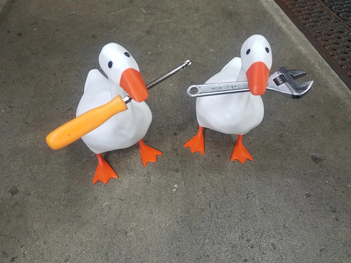 3d printed magnetic goose figurines with tools in beaks