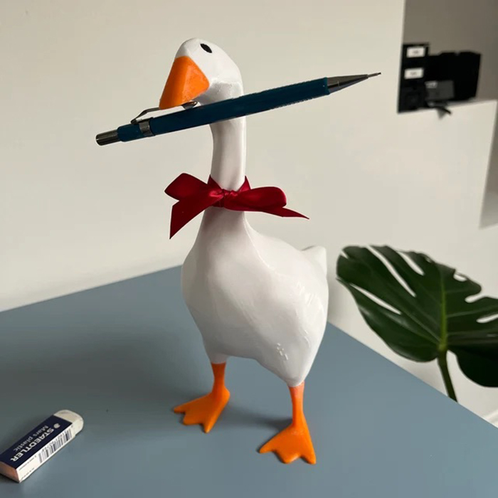 3d printed waterbird figurine with mechanical pencil in beak