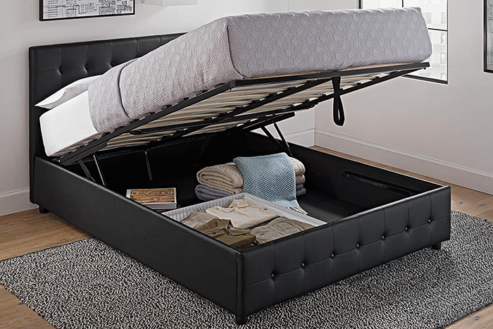 black faux leather upholstered bed with storage