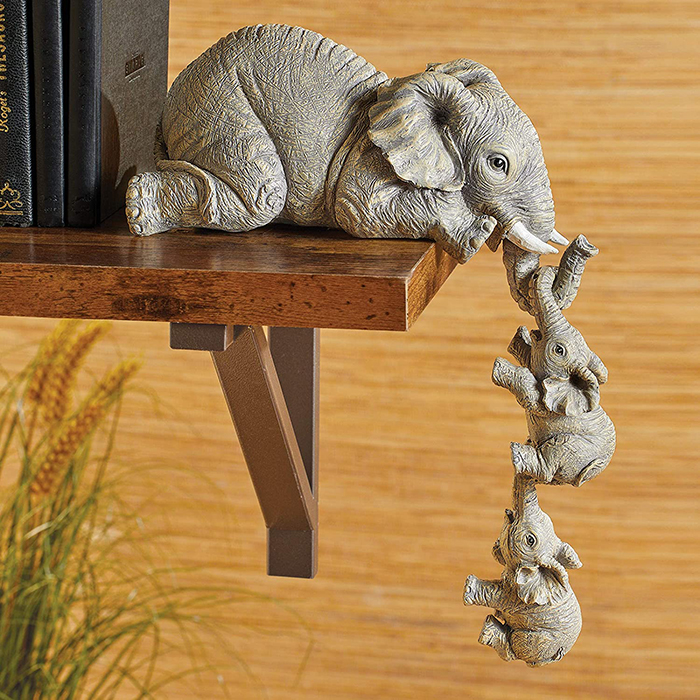 elephant with hanging baby elephants bookend statue