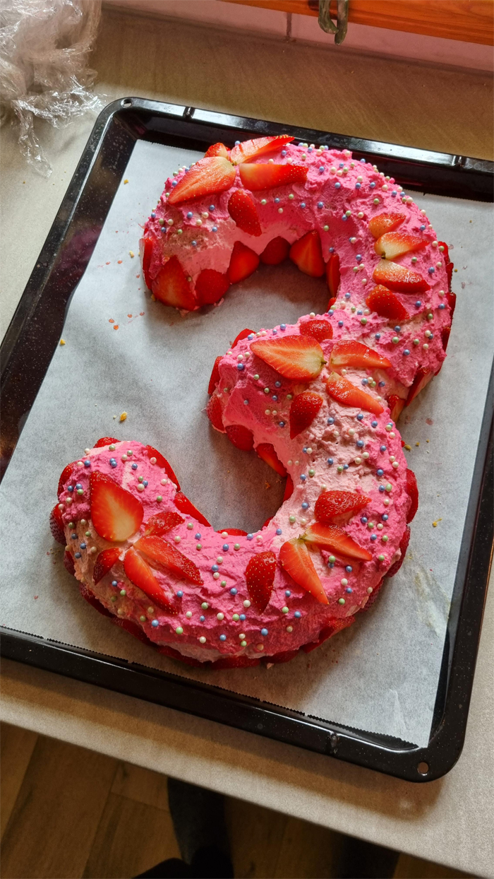 pink strawberry birthday cake